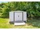 Exterior shot of the storage building in the backyard, offering additional storage solutions for tools and equipment at 624 Wait Ave, Wake Forest, NC 27587