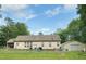 Large backyard with metal shed, fenced perimeter, and mature trees at 67 Bull Run N, Timberlake, NC 27583