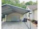 Spacious metal carport and shed perfect for vehicle storage and other equipment at 67 Bull Run N, Timberlake, NC 27583