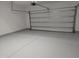 Spacious garage with sealed concrete flooring, white walls, and an automatic door at 7 Mint Hill Ct, Durham, NC 27703