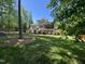 Expansive backyard with a deck, screened in porch, and lush landscaping at 7108 Carries Reach Way Way, Raleigh, NC 27614