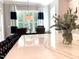 Bright dining area featuring a marble-topped island, elegant seating, and views of the tree-filled yard at 7108 Carries Reach Way Way, Raleigh, NC 27614
