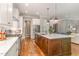 Contemporary kitchen with stainless appliances, custom cabinets, and a large kitchen island at 7108 Carries Reach Way Way, Raleigh, NC 27614