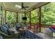 Relaxing screened-in porch with comfortable seating and wooded views at 7108 Carries Reach Way Way, Raleigh, NC 27614