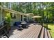 Inviting back deck with seating area, fire pit, and outdoor dining, ideal for relaxing and entertaining at 7200 Rabbit Run, Wake Forest, NC 27587
