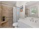 Well-lit bathroom featuring a walk-in shower, a single sink vanity, and modern fixtures at 7200 Rabbit Run, Wake Forest, NC 27587