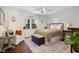 Cozy bedroom featuring a comfortable bed, sitting area, and a large window with natural light at 7200 Rabbit Run, Wake Forest, NC 27587