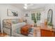 Bright bedroom with daybed, hardwood floors, natural light, and a cozy farmhouse style at 7200 Rabbit Run, Wake Forest, NC 27587