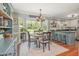 Charming dining area with a round table, adjacent to a well-lit modern kitchen at 7200 Rabbit Run, Wake Forest, NC 27587