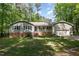 Charming single-story home with a brick foundation, well-maintained lawn, and a two-car garage at 7200 Rabbit Run, Wake Forest, NC 27587