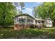 Beautiful home with inviting front porch, charming details, and well-maintained landscaping at 7200 Rabbit Run, Wake Forest, NC 27587