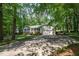 Charming home with a well-manicured lawn and a spacious driveway leading to a two-car garage at 7200 Rabbit Run, Wake Forest, NC 27587