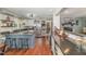 Well-designed kitchen featuring a center island with seating and modern stainless steel appliances at 7200 Rabbit, Wake Forest, NC 27587