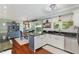 Bright kitchen with a central island, modern countertops, and an adjacent dining area at 7200 Rabbit Run, Wake Forest, NC 27587