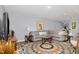 Spacious living room with a large sectional sofa, colorful rug, and ample natural light at 7200 Rabbit Run, Wake Forest, NC 27587