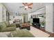 Spacious living room with hardwood floors and a plush sectional sofa for comfortable living at 7200 Rabbit Run, Wake Forest, NC 27587
