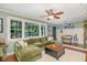 Inviting living room featuring a large sectional sofa, hardwood floors, and bright natural light at 7200 Rabbit Run, Wake Forest, NC 27587