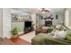 A cozy living room with a fireplace, hardwood floors, and an open layout at 7200 Rabbit Run, Wake Forest, NC 27587
