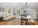 Comfortable living space with neutral decor, table with chairs, and French doors to the exterior at 7200 Rabbit Run, Wake Forest, NC 27587