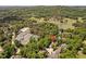Aerial view showcasing tennis courts, a pool and a lake in a picturesque golf course community at 72103 Moseley, Chapel Hill, NC 27517