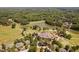 This aerial view reveals a golf course, lake and country club with a well-maintained landscape at 72103 Moseley, Chapel Hill, NC 27517