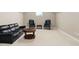 Finished basement featuring neutral carpeting and leather furniture, perfect for recreation at 72103 Moseley, Chapel Hill, NC 27517