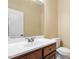 Neutral bathroom featuring a single sink vanity with wood cabinets and toilet at 72103 Moseley, Chapel Hill, NC 27517