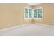Bright bedroom featuring dual windows with views of the lush outdoor landscaping at 72103 Moseley, Chapel Hill, NC 27517