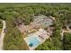 Aerial view of community featuring a pool, tennis courts, clubhouse, and lush greenery at 72103 Moseley, Chapel Hill, NC 27517