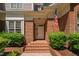 Inviting front entrance featuring brick steps, brick surround, and an American flag at 72103 Moseley, Chapel Hill, NC 27517