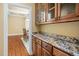 Kitchen features granite countertops, wood cabinets, and appliances; open to the dining room at 72103 Moseley, Chapel Hill, NC 27517