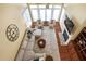 Bright living room with a fireplace, large windows, and comfortable seating arrangement, perfect for relaxation at 72103 Moseley, Chapel Hill, NC 27517
