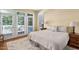 Inviting main bedroom with balcony access, soft rug, and neutral decor for a peaceful retreat at 72103 Moseley, Chapel Hill, NC 27517