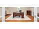 Home office featuring hardwood floors, a dark wood desk, and a comfortable chair for productivity at 72103 Moseley, Chapel Hill, NC 27517