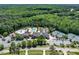 Aerial view of the community amenities featuring pool, clubhouse, tennis courts, and parking at 7616 Hasentree Way, Wake Forest, NC 27587