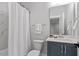 Bathroom featuring a large vanity and shower with white marble tiling at 7616 Hasentree Way, Wake Forest, NC 27587