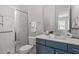 Bathroom featuring a glass-enclosed shower and modern vanity at 7616 Hasentree Way, Wake Forest, NC 27587