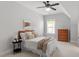 Bedroom featuring a decorative painting and a ceiling fan at 7616 Hasentree Way, Wake Forest, NC 27587
