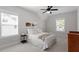 Bedroom with a sloped ceiling, ceiling fan, and two windows at 7616 Hasentree Way, Wake Forest, NC 27587