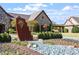 Clubhouse with beautiful stone exterior and landscaping at 7616 Hasentree Way, Wake Forest, NC 27587