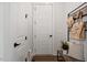 Bright entryway features white trim, storage hooks and bench at 7616 Hasentree Way, Wake Forest, NC 27587
