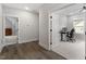 Bright hallway with wood floors leading to an office space at 7616 Hasentree Way, Wake Forest, NC 27587