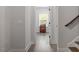 Hallway with white walls and white trim, leading to a bedroom at 7616 Hasentree Way, Wake Forest, NC 27587