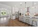 Spacious kitchen with a large center island, stainless steel appliances, and white cabinets offering ample storage at 7616 Hasentree Way, Wake Forest, NC 27587