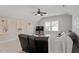 Upstairs living room with a large leather couch and ample seating for entertaining at 7616 Hasentree Way, Wake Forest, NC 27587