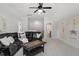 Cozy upstairs living room with carpeting, ceiling fan, and a comfortable seating area at 7616 Hasentree Way, Wake Forest, NC 27587