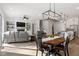 Open-concept living space combines kitchen, dining, and living areas for entertaining at 7616 Hasentree Way, Wake Forest, NC 27587