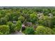 An aerial shot of a home surrounded by green trees and manicured landscaping at 804 Warwick Ct, Burlington, NC 27215