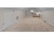 A long and wide attic with a small window and carpeting at 804 Warwick Ct, Burlington, NC 27215