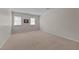 Neutral bedroom with carpeted floors and natural lighting from two windows, creating a serene atmosphere at 804 Warwick Ct, Burlington, NC 27215